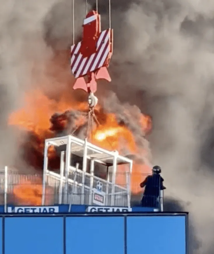 Reading fire footage as crane operator saves a colleague.