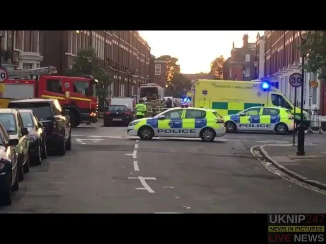 Man  arrested after three found dead in Liverpool flat
