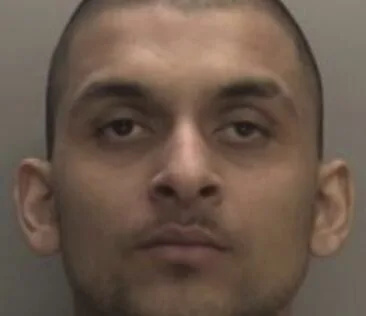A robber who pounced on his victim after spotting him withdrawing cash from a post office has been locked up