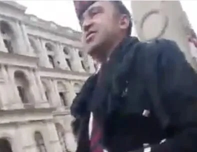 Disgraceful piper who attempted to barge through a police cordon on Remembrance Sunday charged with assault
