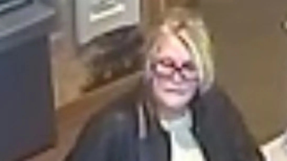 Police are appealing for information after a woman impersonated another customer at a bank to obtain a new bank card