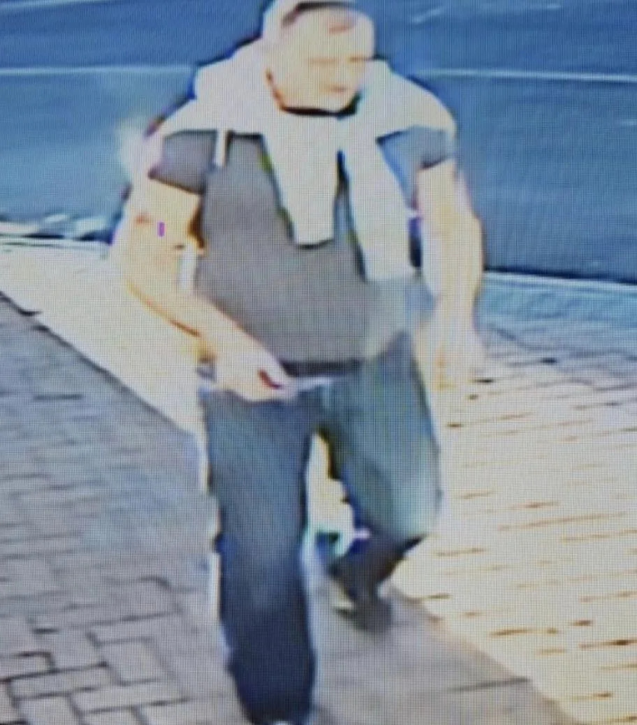 Police would like to speak to this man after the body of a cat was found on a driveway in Lancing