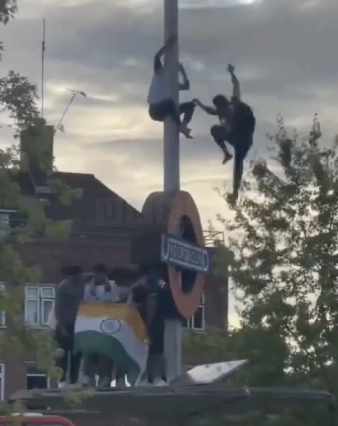 Queensbury Cricket Celebrations Marred as Fan Falls from Tube Sign, Seriously Injured