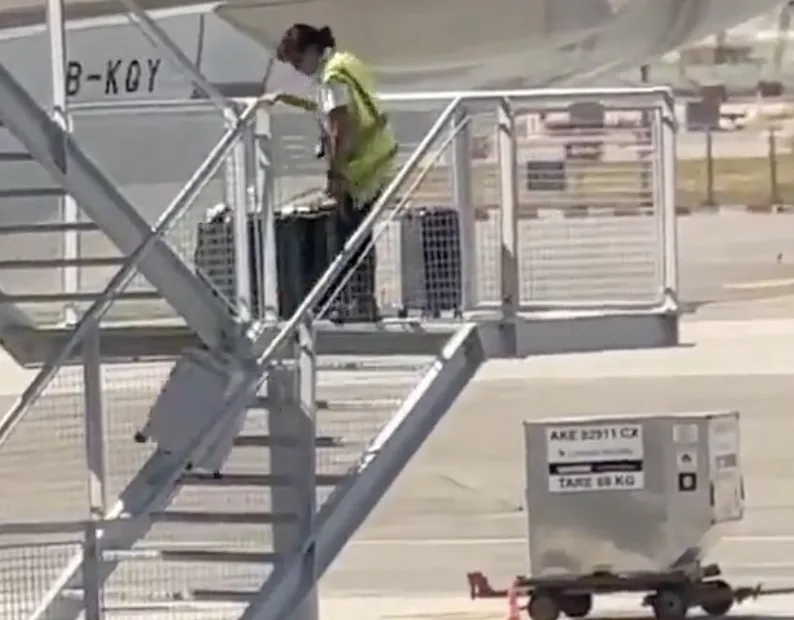 Cathay Pacific Worker Suspended After Shocking Viral Video Shows Suitcases Thrown Down Stairs at KL Airport