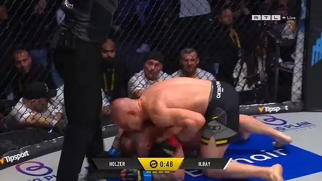 MMA Fighter Punched Through Cage After Controversial Kiss Incident