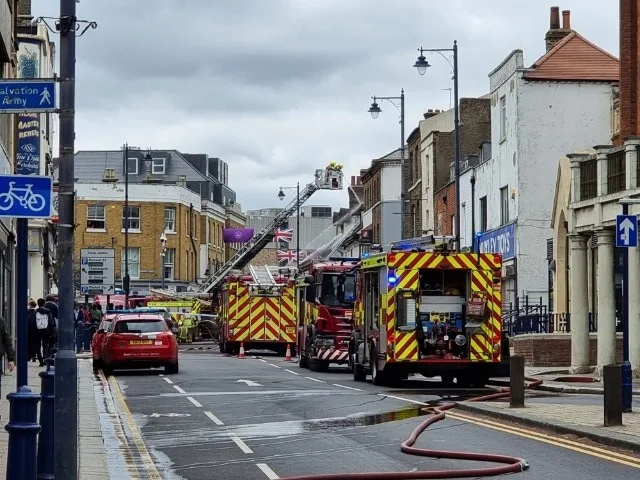 Kent Fire and Rescue Service remains at the scene of a fire at a commercial premises at the junction of Queen Street and Milton Road, in …