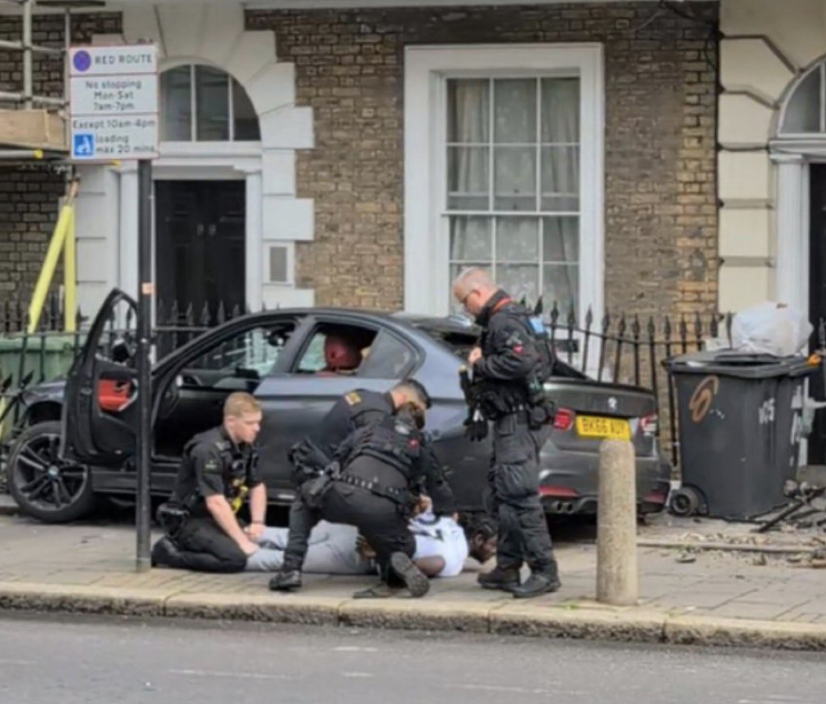 Man Arrested Following Police Chase That Ends with Police Car Overturned