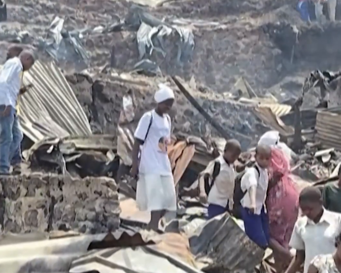 Children killed after huge fire tears through schools in DR Congo and sparks stampede